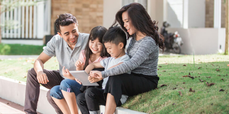 Family looking at computer
