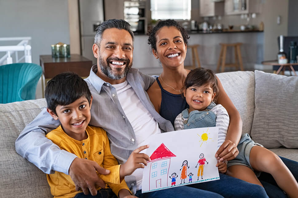 Smiling family with drawing