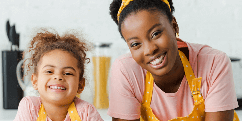 Mom and daughter smiling