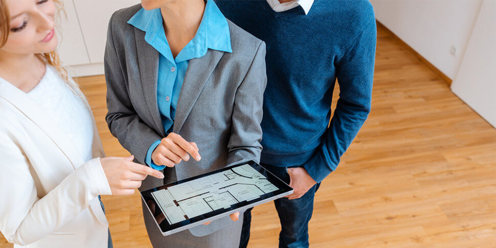 Couple looking at floor plan